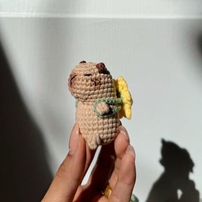 Capybara with sunflower backpack