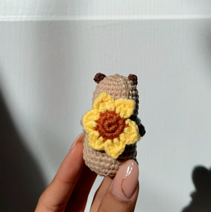 Capybara with sunflower backpack