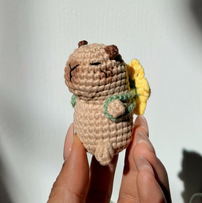 Capybara with sunflower backpack