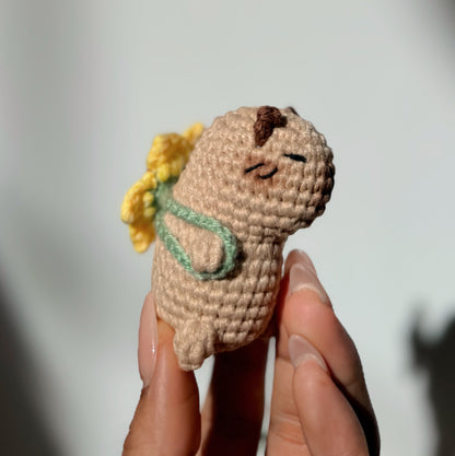Capybara with sunflower backpack